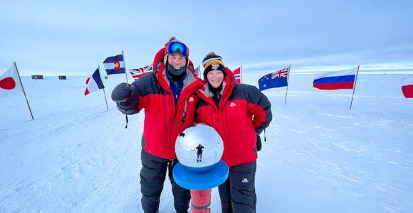 Two tourists at the South Pole