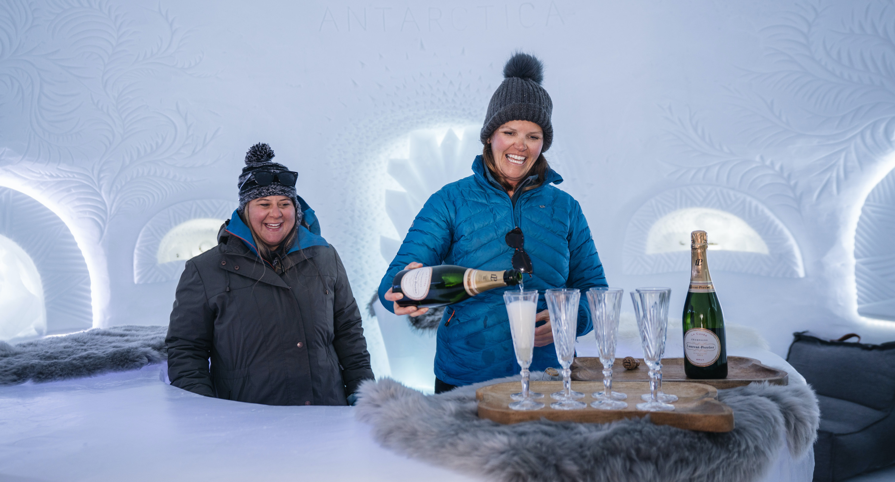 Drinking champagne at a luxury Antarctica camp