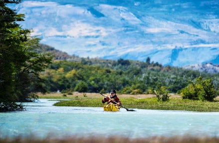 A man kayaks in Puerto Williams during a stay at The Cormorant at 55 South