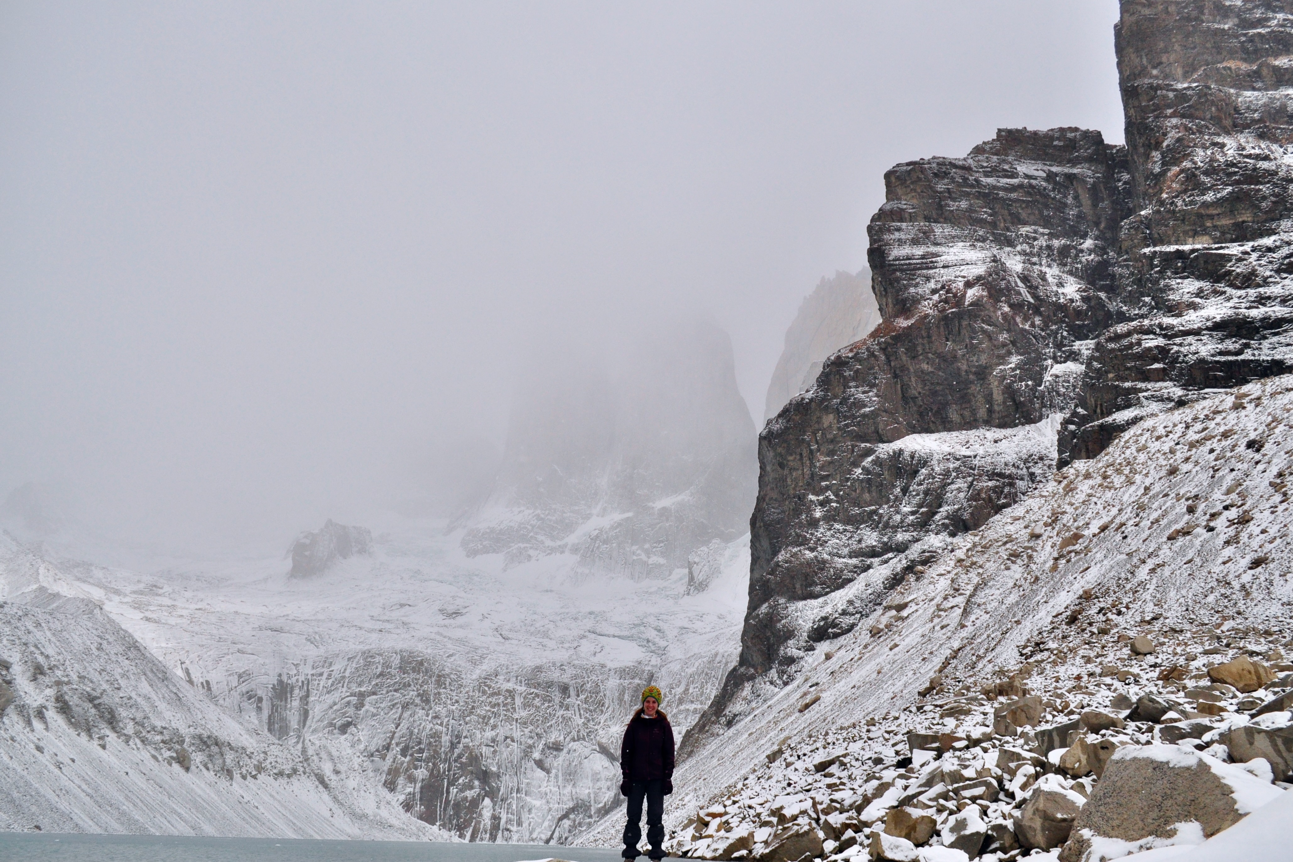 Natalia standing in Torres del Paine lookout with winter scenery